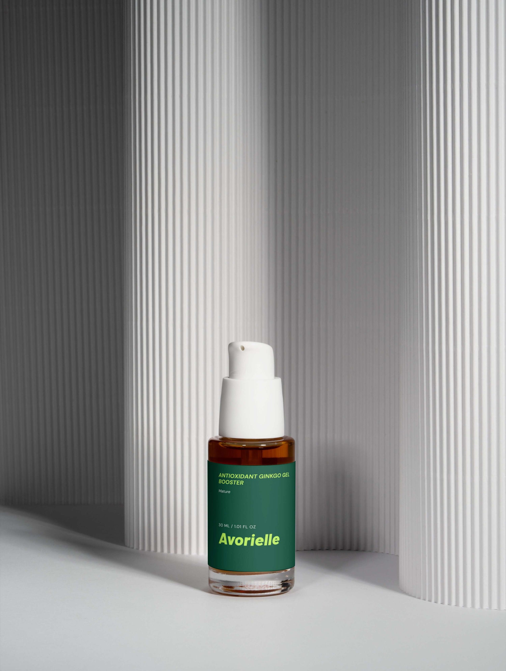 Antioxidant Ginkgo Gel Booster from Avorielle in a sleek bottle against textured white background.